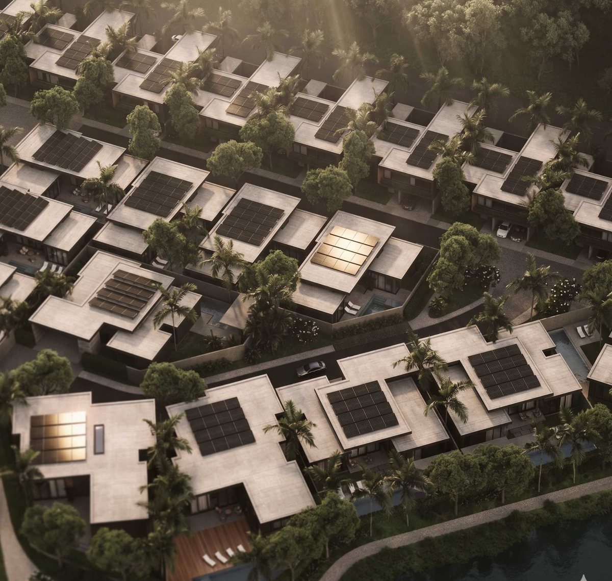 Villa roofs with solar panels next to the lake